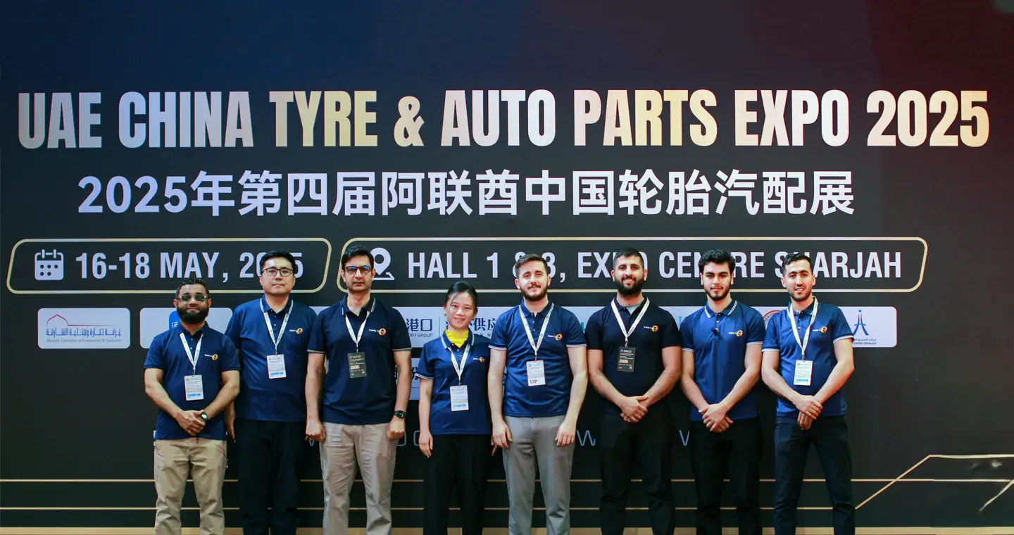 Fales Grand Team at UAE China Tyre & Auto Parts Expo 2025 Fales Grand staff group photo in front of UAE China Tyre & Auto Parts Expo 2025 backdrop at Expo Centre Sharjah, following a successful event.