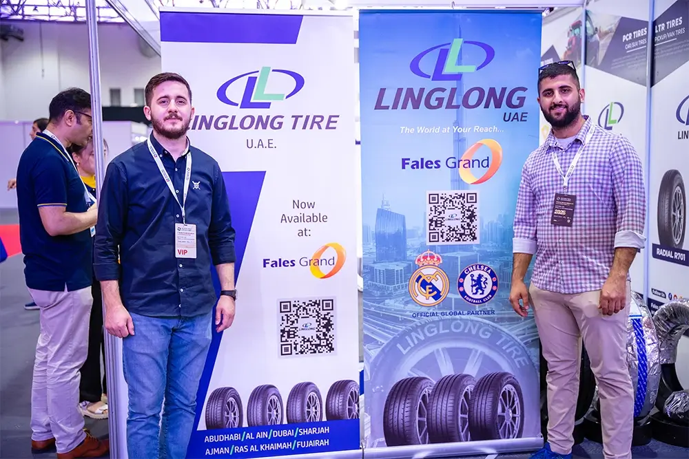 Fales Grand team poses in front of the UAE China Tyre & Auto Parts Expo 2025 backdrop at Expo Centre Sharjah.
