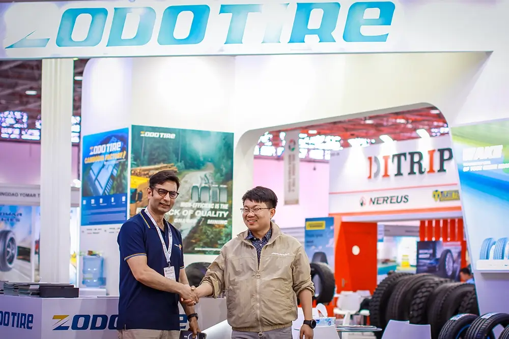 Fales Grand team poses in front of the UAE China Tyre & Auto Parts Expo 2025 backdrop at Expo Centre Sharjah.