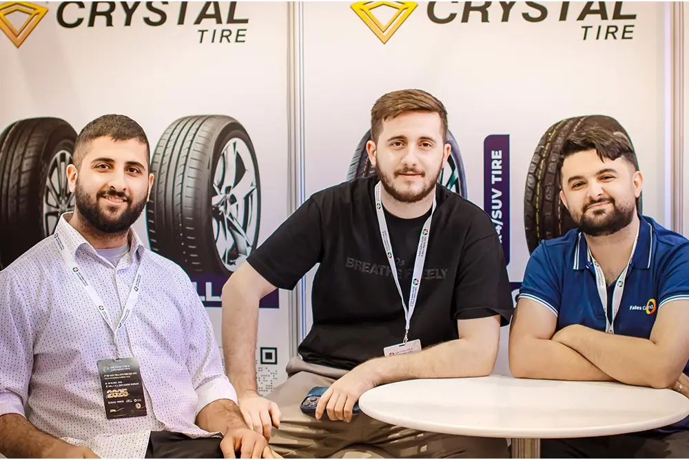 Fales Grand team poses in front of the UAE China Tyre & Auto Parts Expo 2025 backdrop at Expo Centre Sharjah.
