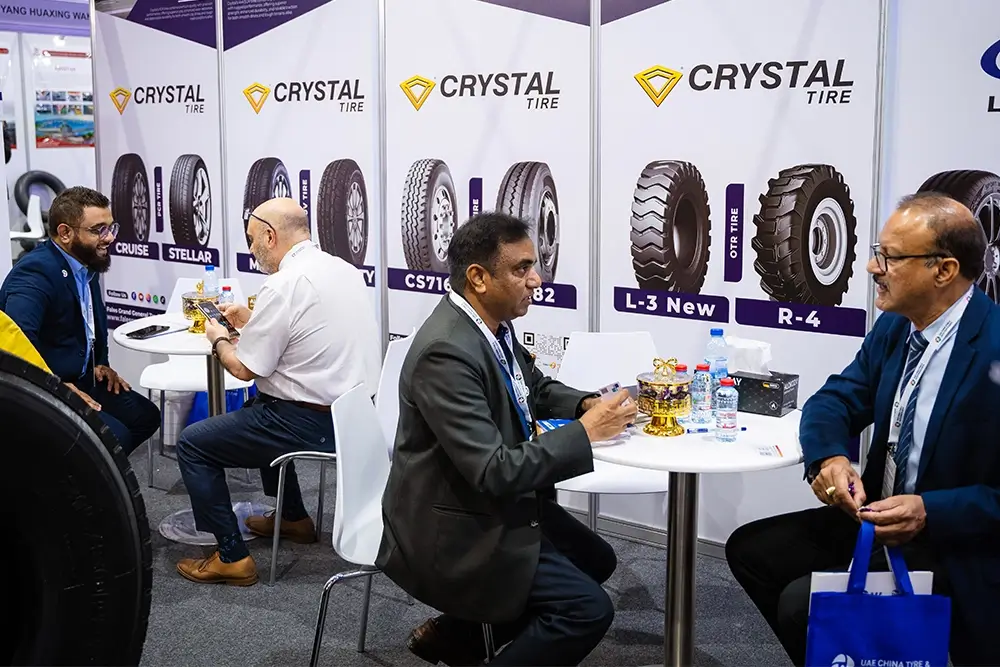 Fales Grand team poses in front of the UAE China Tyre & Auto Parts Expo 2025 backdrop at Expo Centre Sharjah.