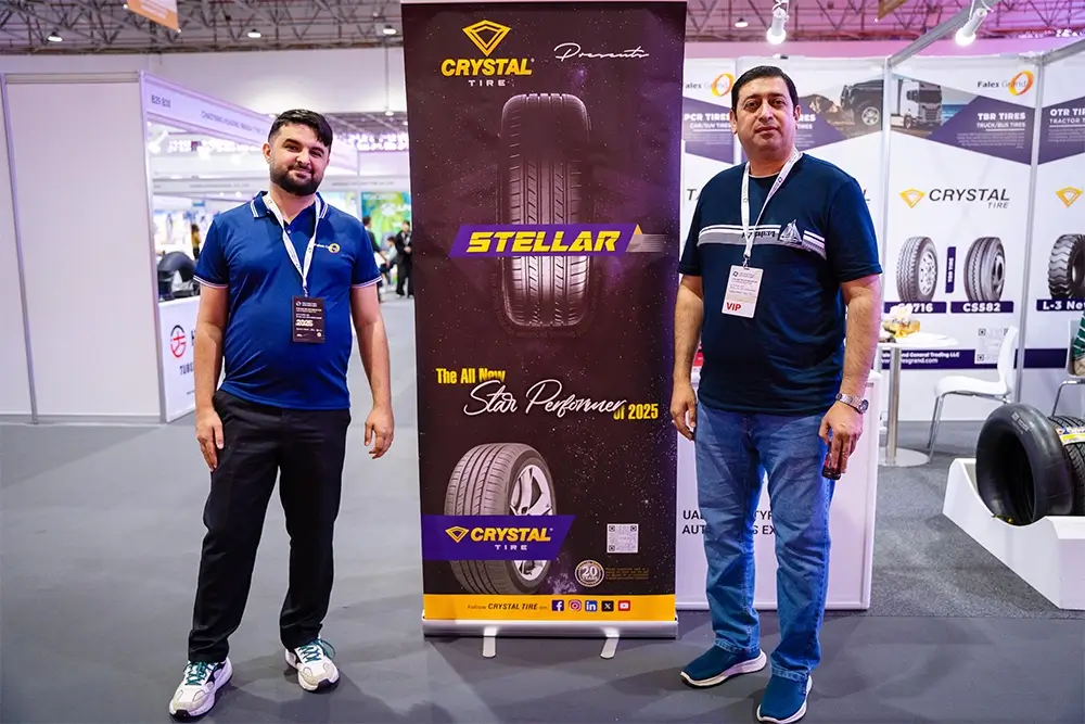 Fales Grand team poses in front of the UAE China Tyre & Auto Parts Expo 2025 backdrop at Expo Centre Sharjah.
