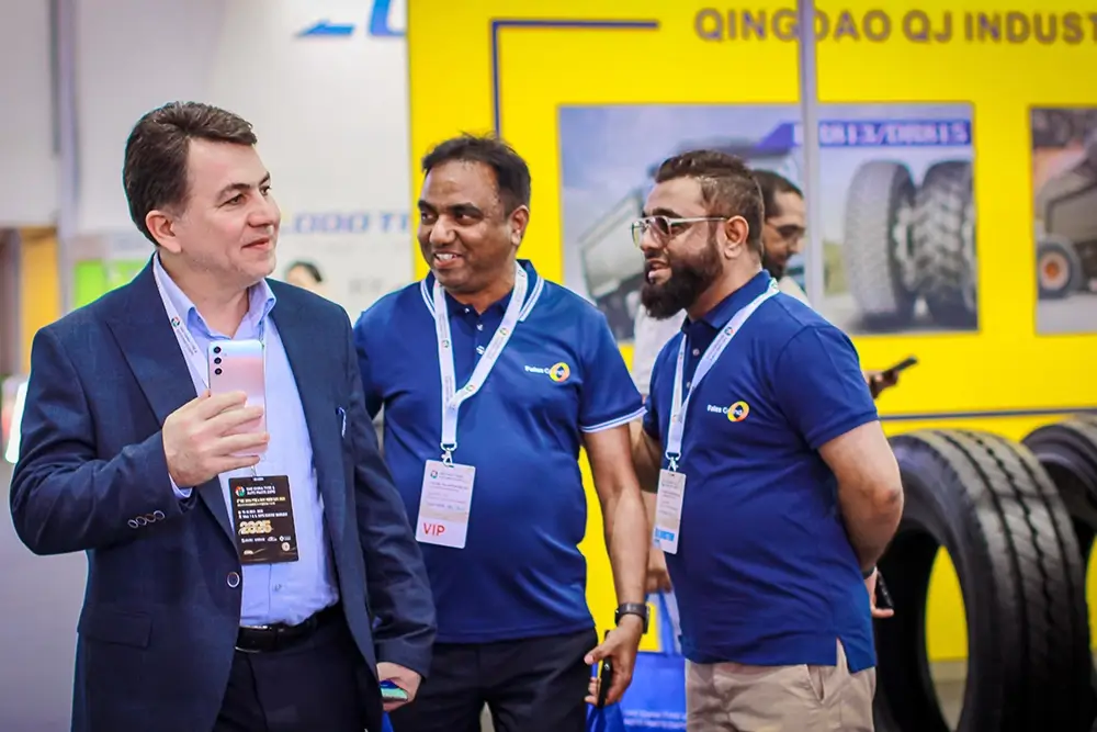 Fales Grand team poses in front of the UAE China Tyre & Auto Parts Expo 2025 backdrop at Expo Centre Sharjah.
